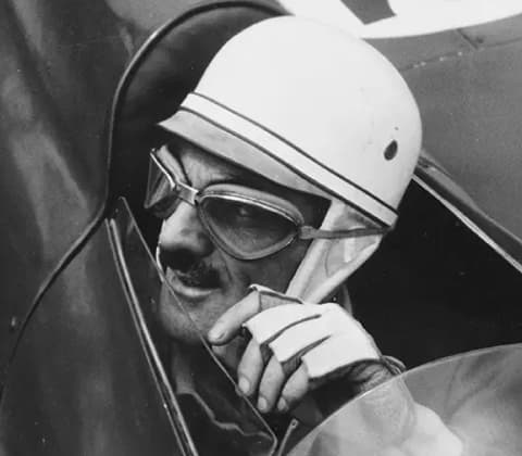 A portrait of Carlo Mollino in a race car